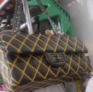 Black and yellow flap bag